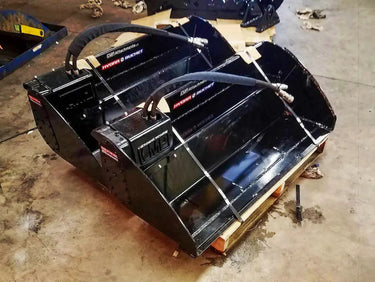The image shows two black buckets sitting on a wooden pallet. The text